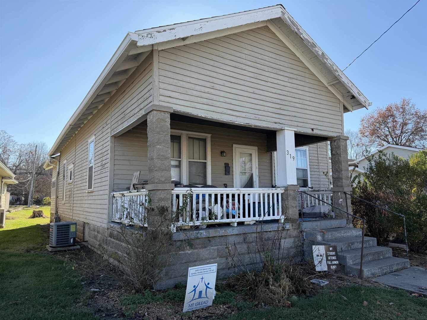 331 West Main Street Olney, IL 62450 - Photo 5 of 58 a front view of a house with garden