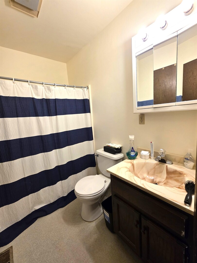 331 West Main Street Olney, IL 62450 - Photo 54 of 58 a bathroom with a sink and a mirror