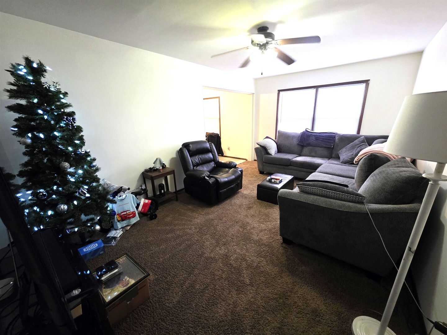 331 West Main Street Olney, IL 62450 - Photo 55 of 58 a living room with furniture flowers and a chandelier