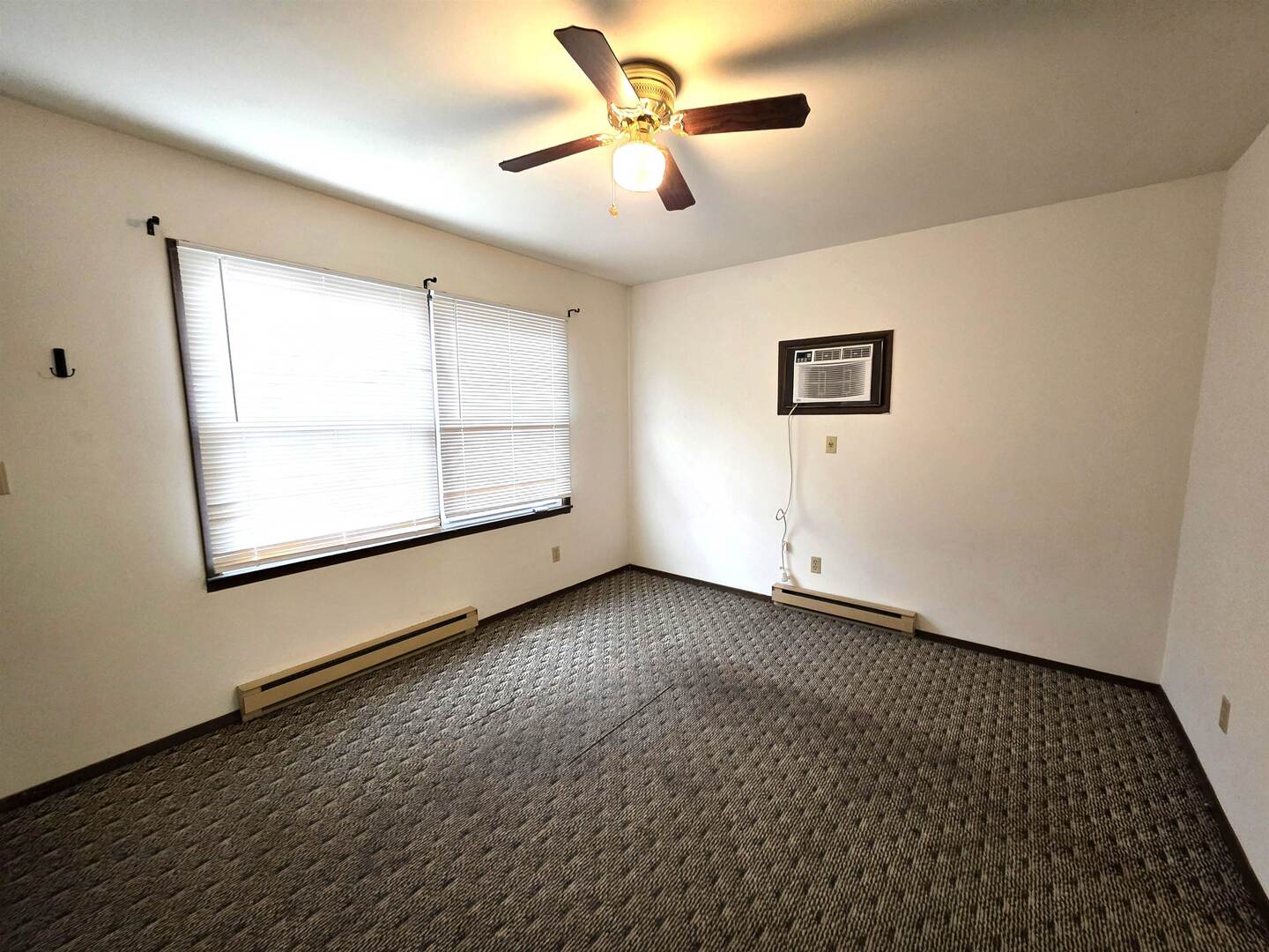 331 West Main Street Olney, IL 62450 - Photo 8 of 58 a view of an empty room with a window