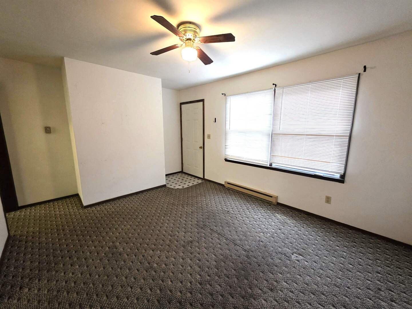 331 West Main Street Olney, IL 62450 - Photo 10 of 58 an empty room with windows and fan