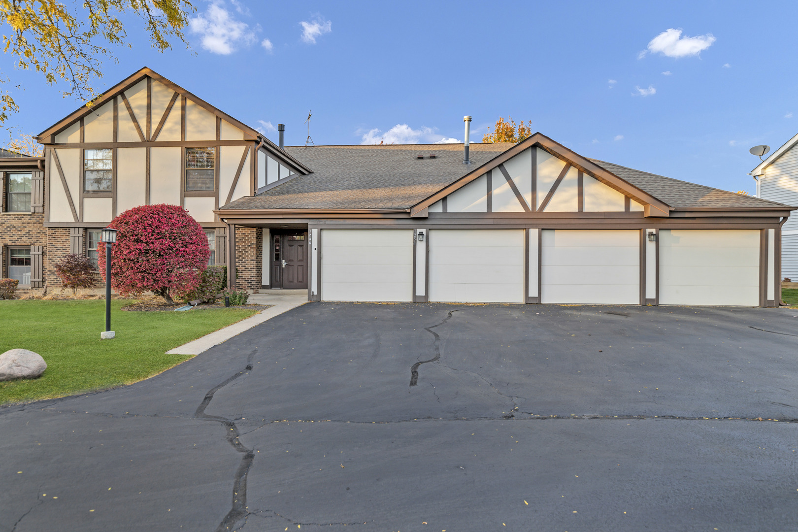 1256 Plum Tree Court, Unit D1 Schaumburg, IL 60193 - Photo 1 of 40 a view of house with a big yard and potted plants