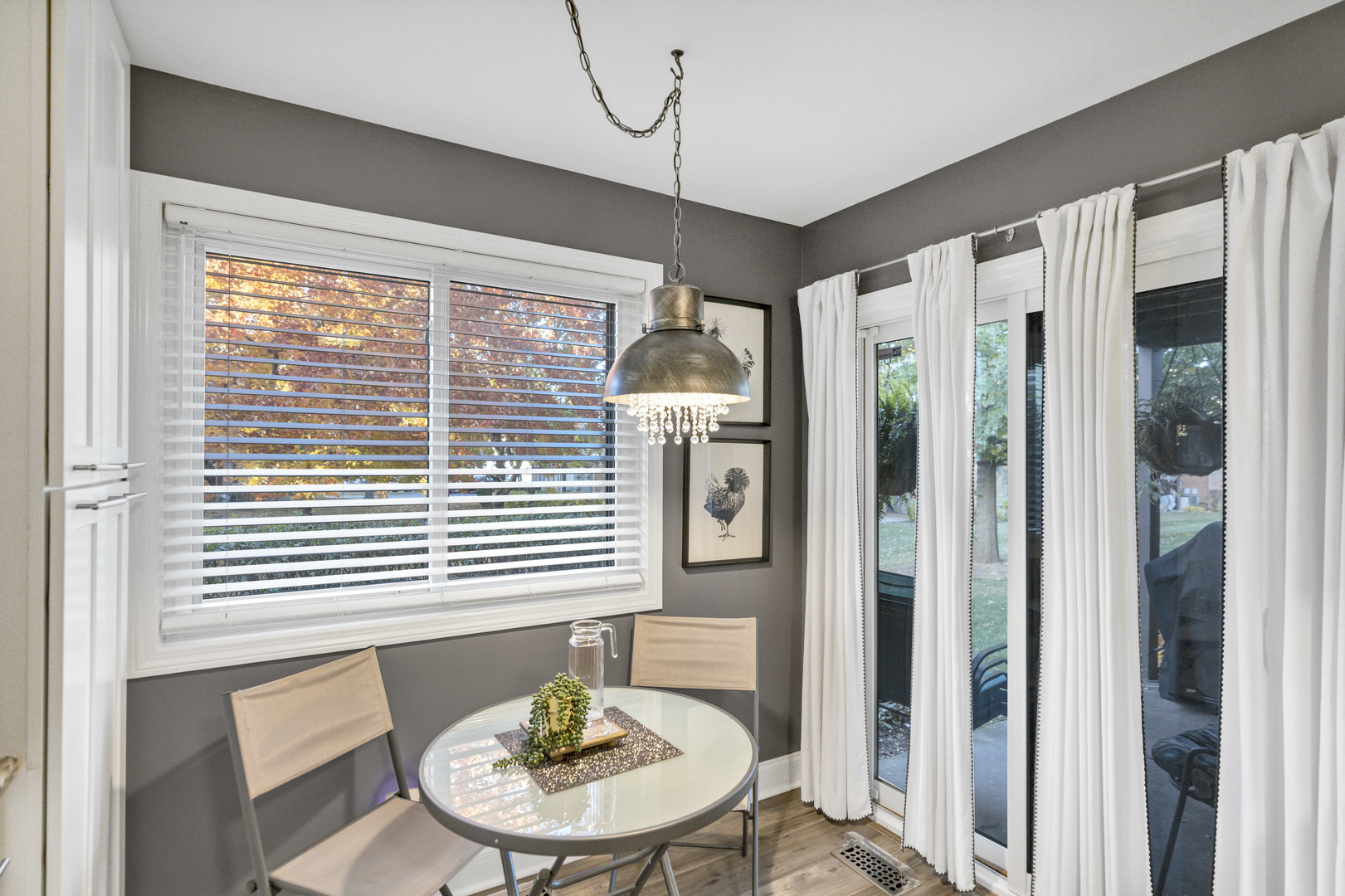 1256 Plum Tree Court, Unit D1 Schaumburg, IL 60193 - Photo 11 of 40 a view of a dining room with furniture window and wooden floor