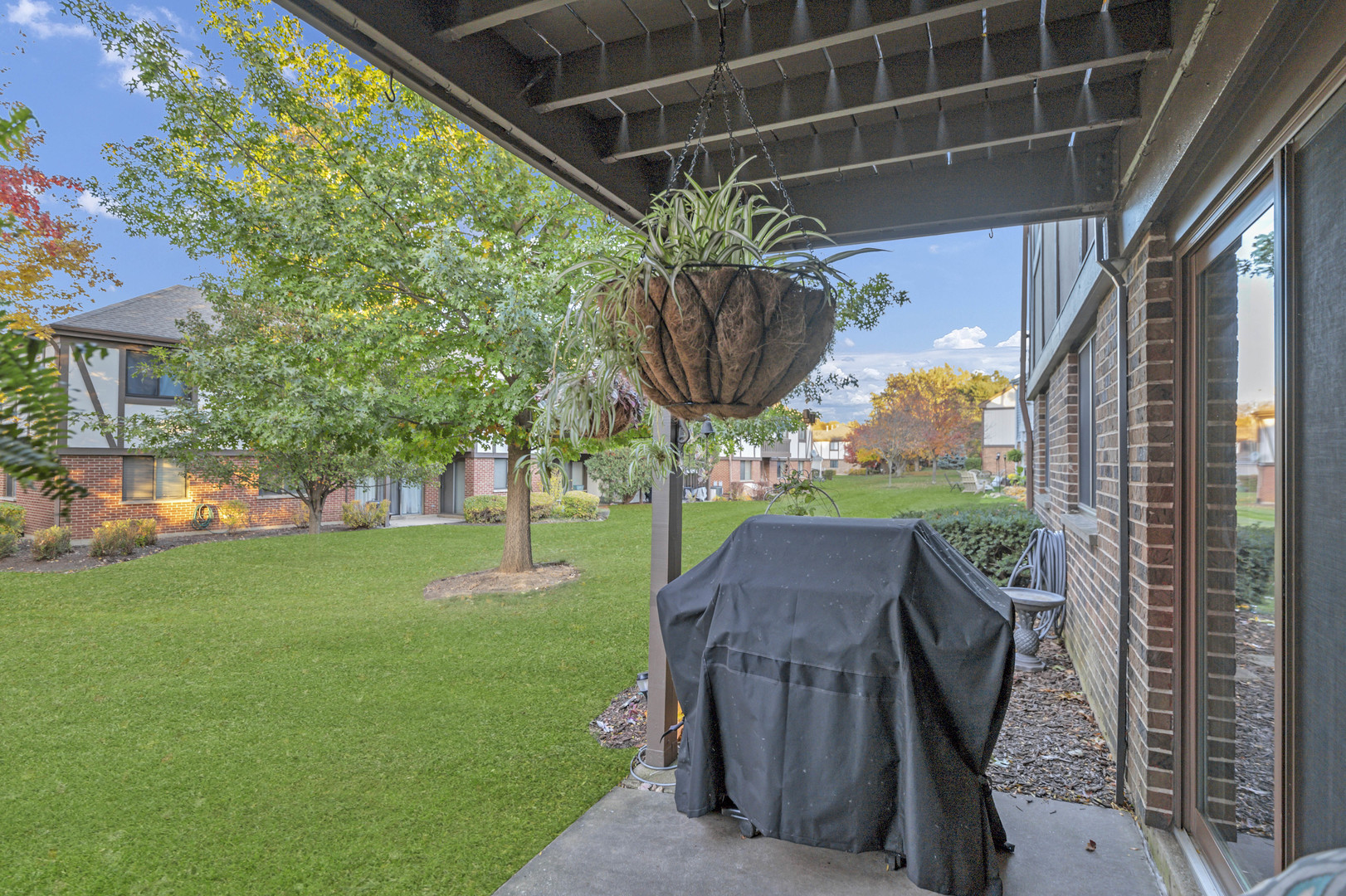 1256 Plum Tree Court, Unit D1 Schaumburg, IL 60193 - Photo 23 of 40 a view of yard with swimming pool and green space