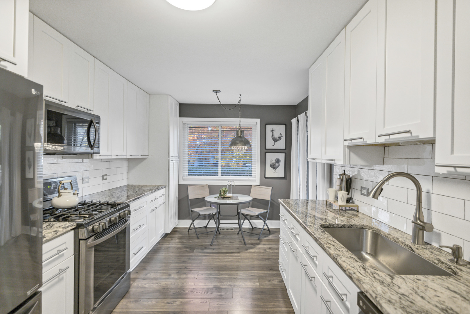 1256 Plum Tree Court, Unit D1 Schaumburg, IL 60193 - Photo 8 of 40 a kitchen with stainless steel appliances granite countertop a stove and a sink