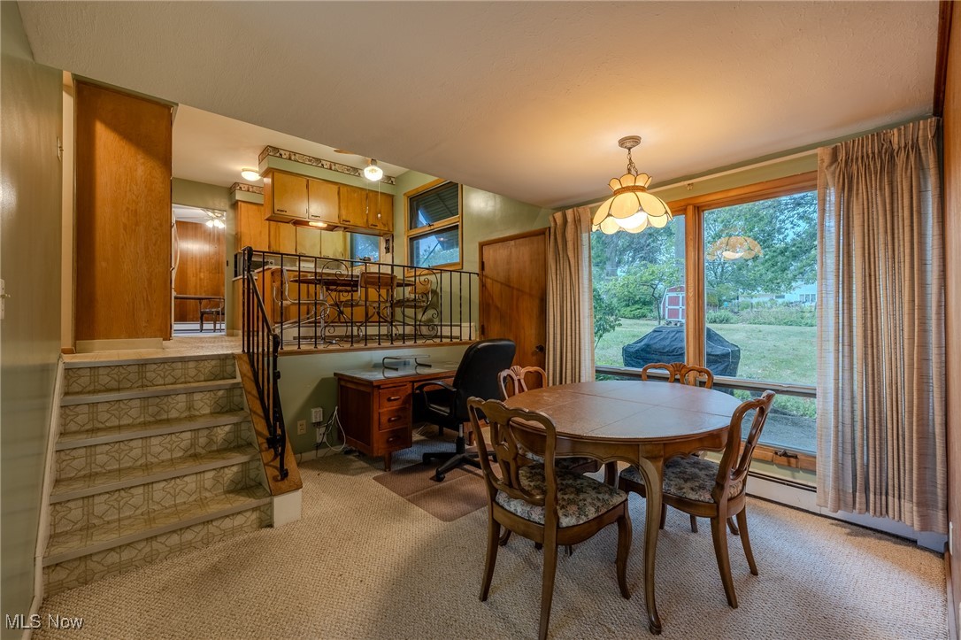 1950 Rush Road Wickliffe, OH 44092 - Photo 40 of 50 Dining room featuring an office area, light carpet, and stairway
