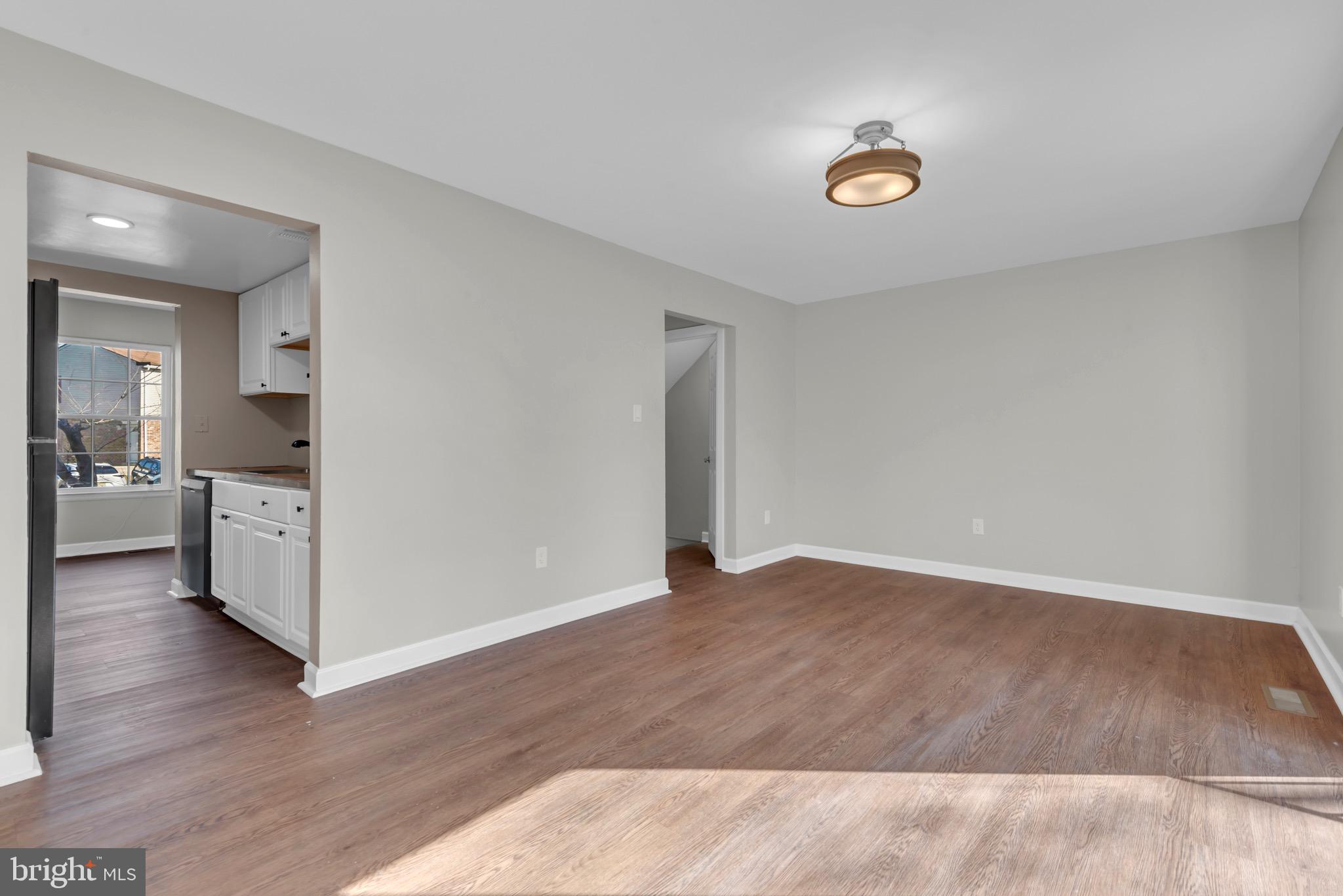 1869 Robin Court Severn, MD 21144 - Photo 15 of 43 a view of a kitchen with wooden floor and a sink