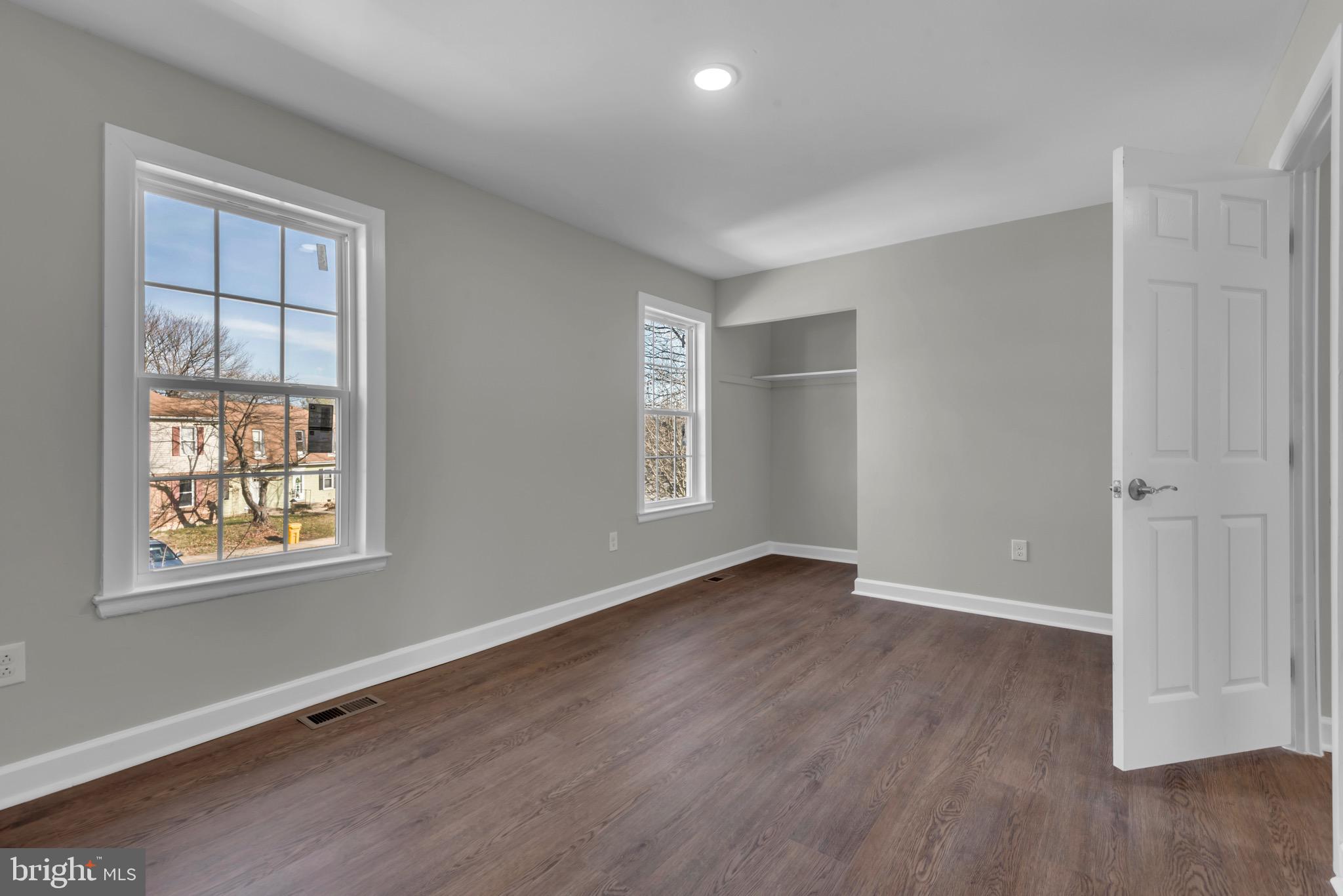 1869 Robin Court Severn, MD 21144 - Photo 21 of 43 an empty room with wooden floor and windows