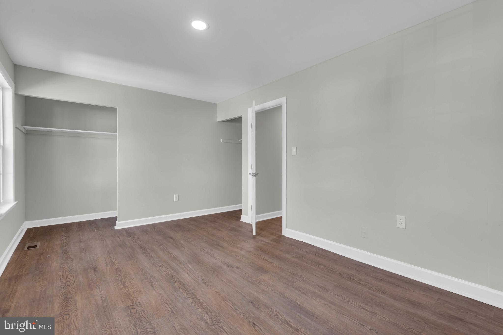 1869 Robin Court Severn, MD 21144 - Photo 22 of 43 an empty room with wooden floor & window