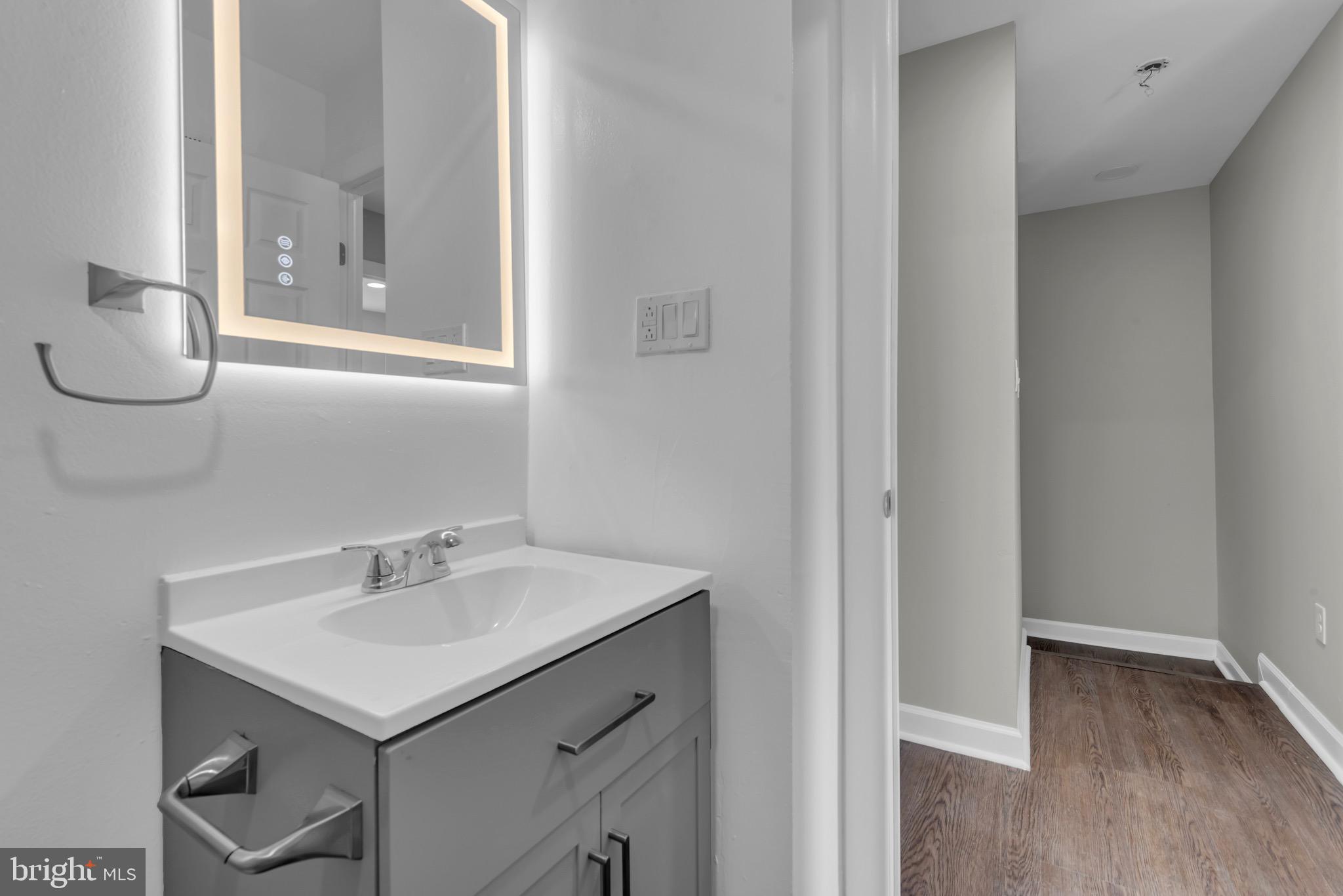 1869 Robin Court Severn, MD 21144 - Photo 26 of 43 a bathroom with a sink and a mirror