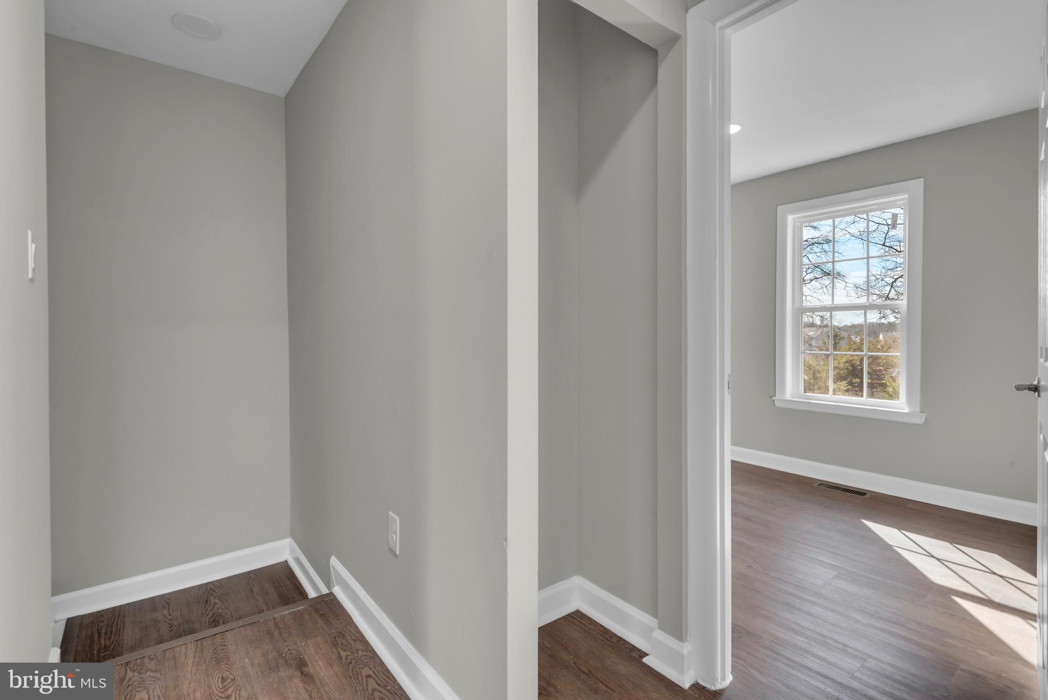 1869 Robin Court Severn, MD 21144 - Photo 27 of 43 an empty room with wooden floor and a window
