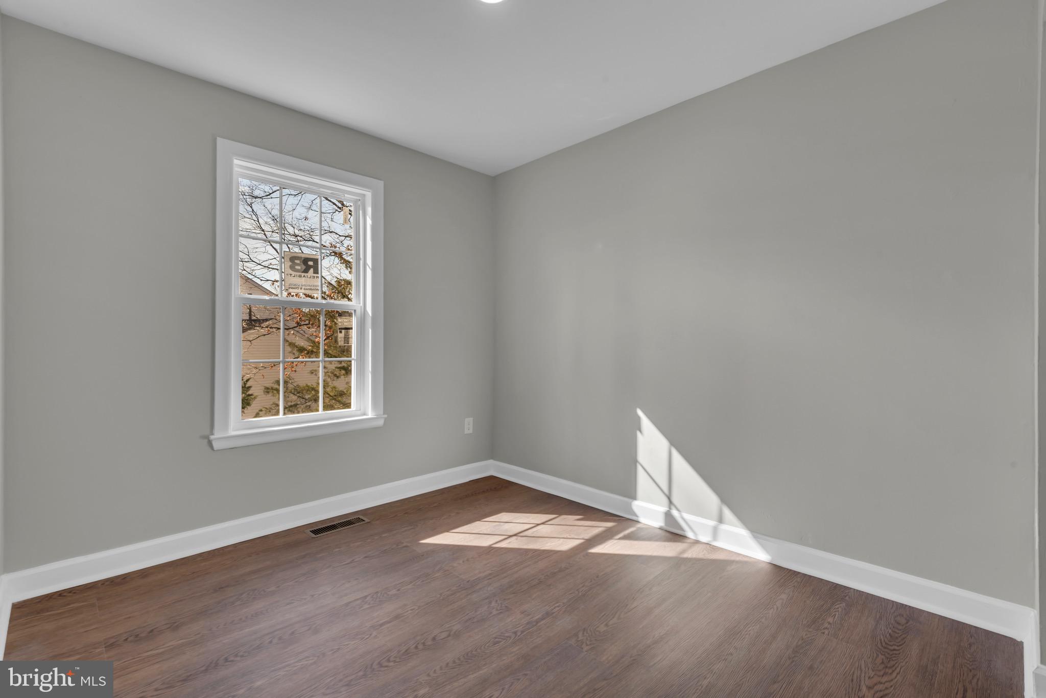 1869 Robin Court Severn, MD 21144 - Photo 28 of 43 an empty room with wooden floor and window