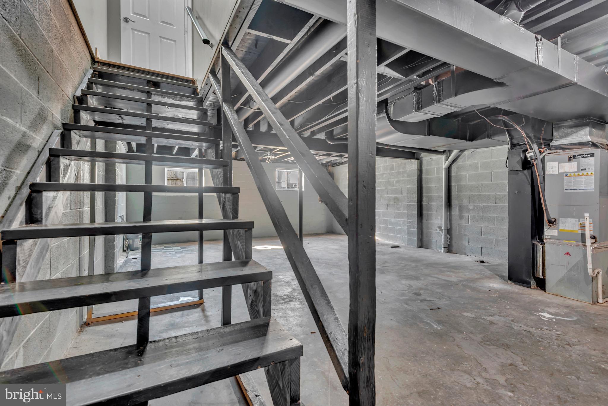 1869 Robin Court Severn, MD 21144 - Photo 32 of 43 a view of staircase with lots of frames on wall