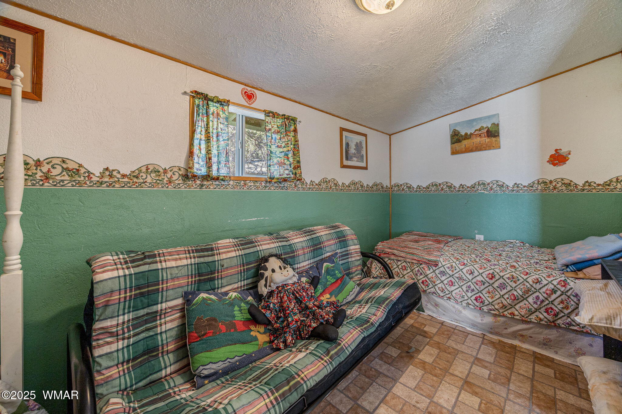 2888 Dale Road Overgaard, AZ 85933 - Photo 7 of 31 a bedroom with furniture and a window