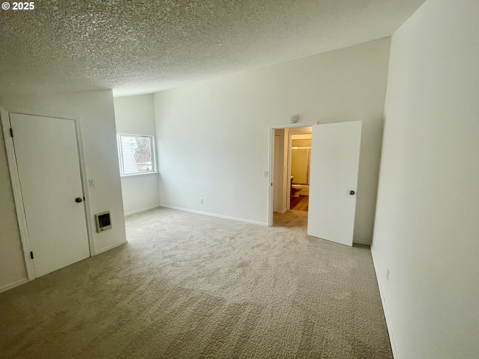 732 Southeast Rene Avenue Gresham, OR 97080 - Photo 11 of 11 an empty room with an entryway and wooden floor