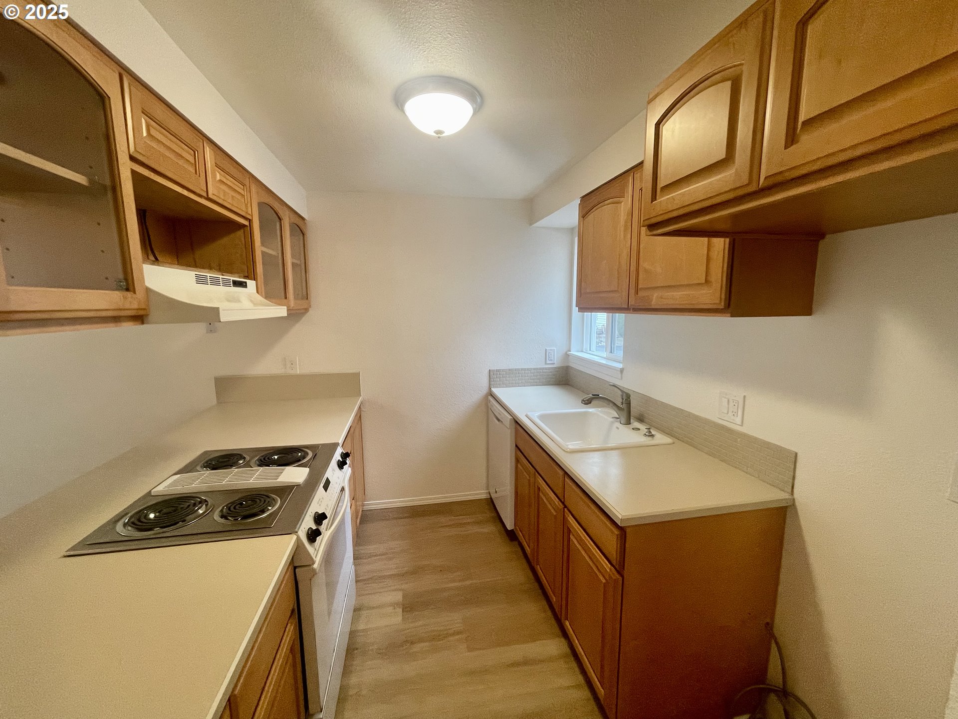 732 Southeast Rene Avenue Gresham, OR 97080 - Photo 2 of 11 a kitchen with a stove and a microwave