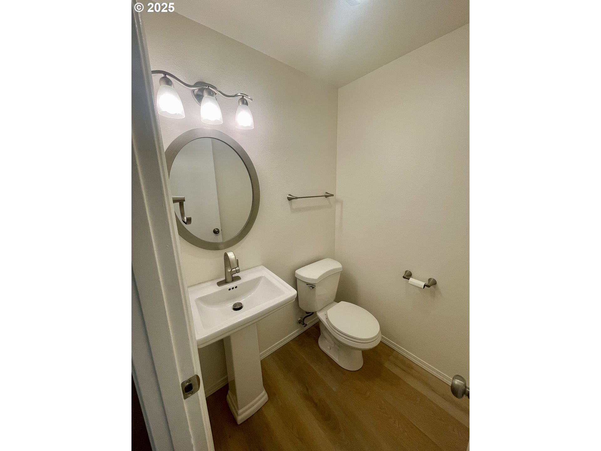 732 Southeast Rene Avenue Gresham, OR 97080 - Photo 6 of 11 a bathroom with a toilet sink and mirror