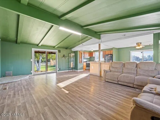 a view of backyard with window and wooden floor
