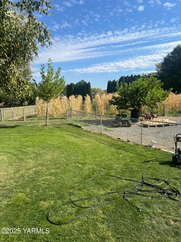 a backyard of a house with lots of green space