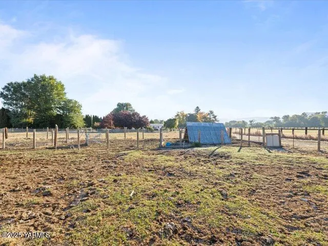 a view of a golf course with a lake