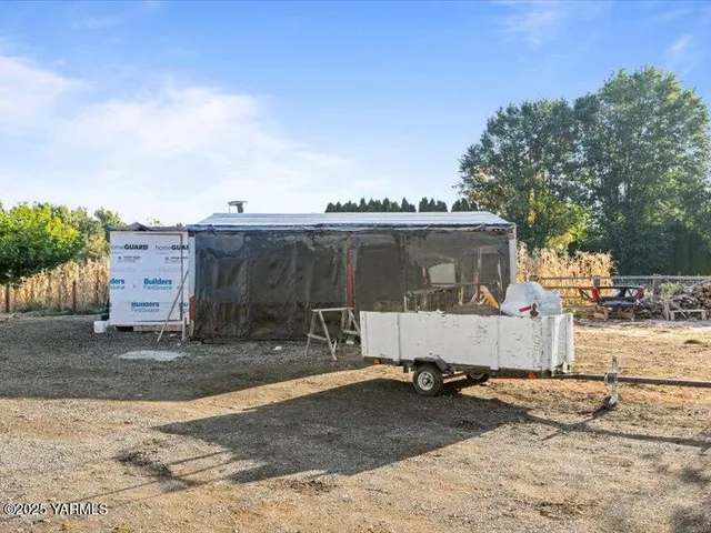 a swimming pool with some trees in the background