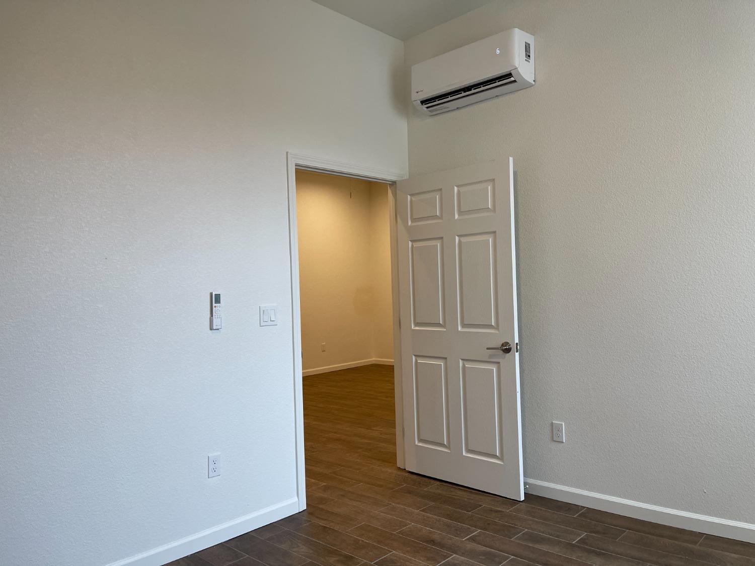 217 5th Street, Unit C Colusa, CA 95932 - Photo 11 of 13 an empty room with wooden floor and closet