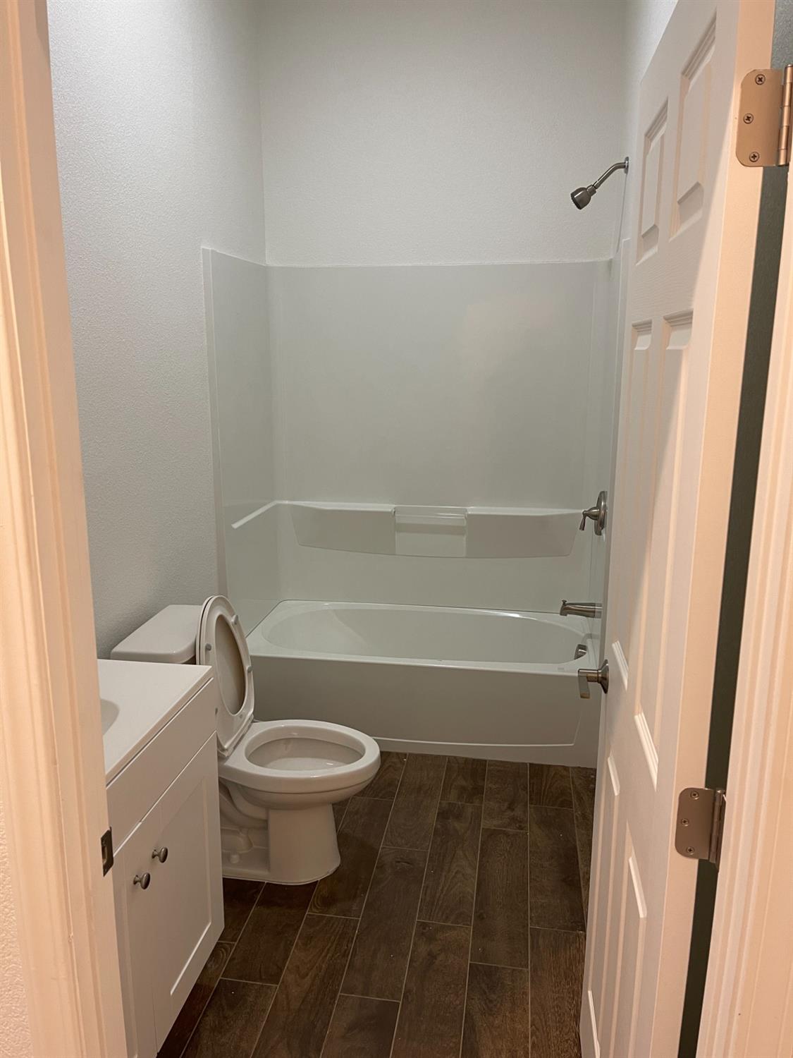 217 5th Street, Unit C Colusa, CA 95932 - Photo 3 of 13 a bathroom with a toilet and a shower