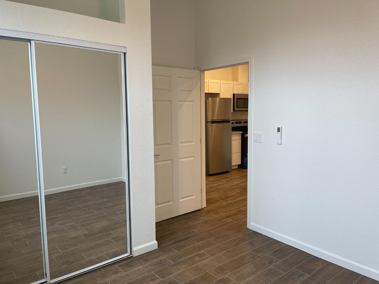 217 5th Street, Unit C Colusa, CA 95932 - Photo 8 of 13 an empty room with wooden floor and closet