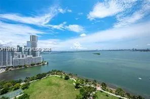 a view of a lake with a yard