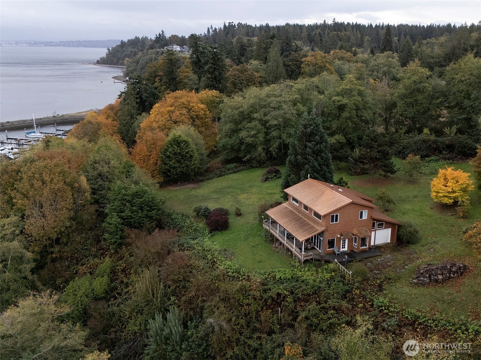 an aerial view of a house with big yard