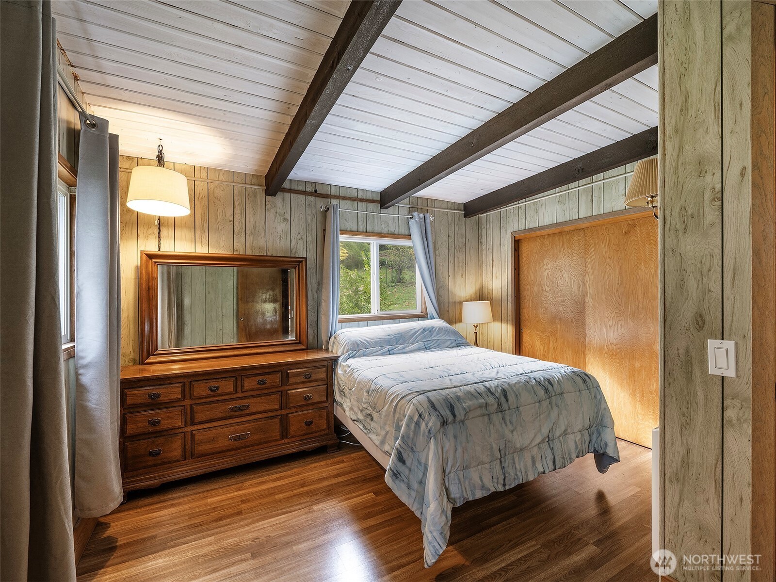26 E Port Everett, WA 98201 - Photo 15 of 33 a bedroom with a bed and wooden floor