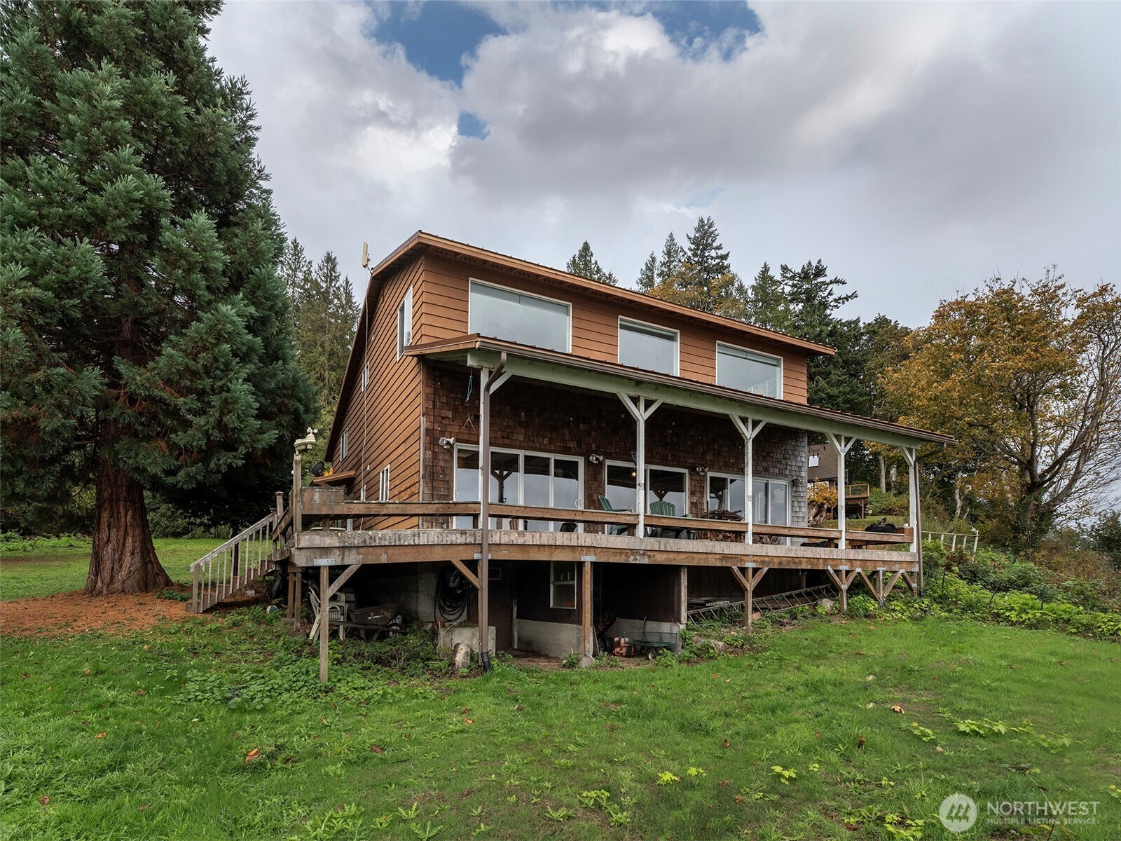 26 E Port Everett, WA 98201 - Photo 33 of 33 a view of a house with a big yard and large trees