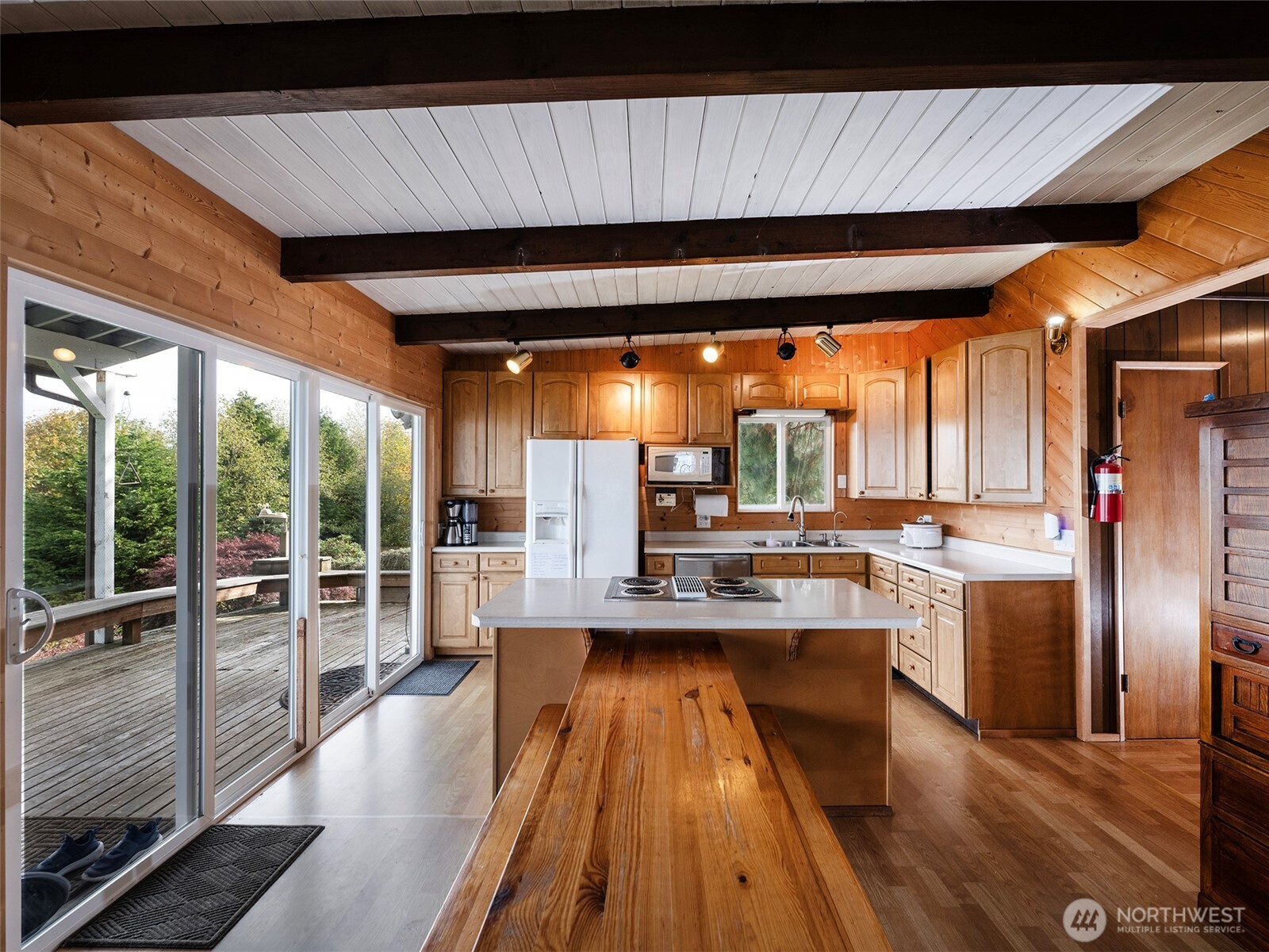 26 E Port Everett, WA 98201 - Photo 6 of 33 view of a kitchen with kitchen island a large window cabinets a sink and stainless steel appliances