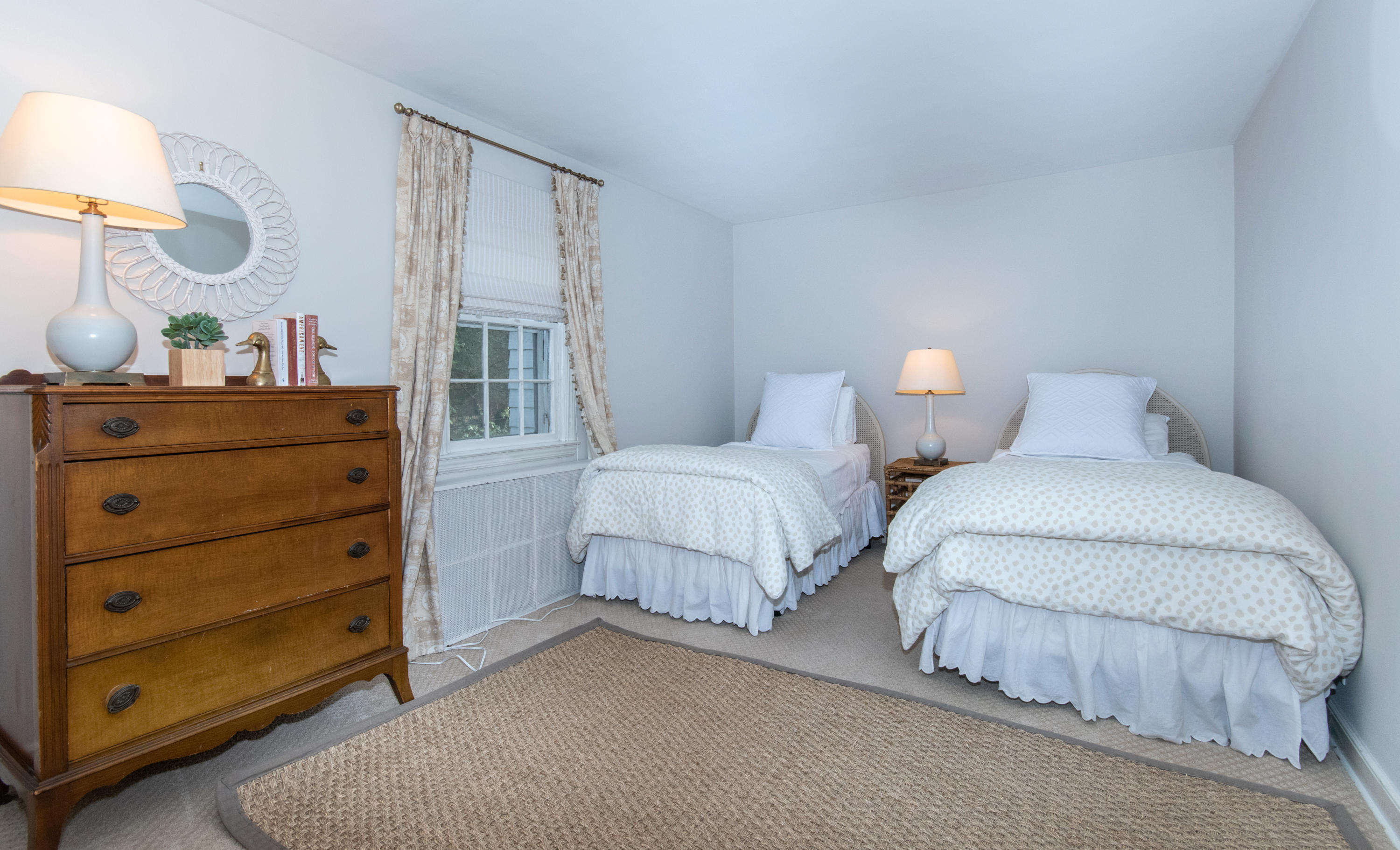 18 Seagate Road Darien, CT 06820 - Photo 12 of 27 a bedroom with two beds and painting on the wall