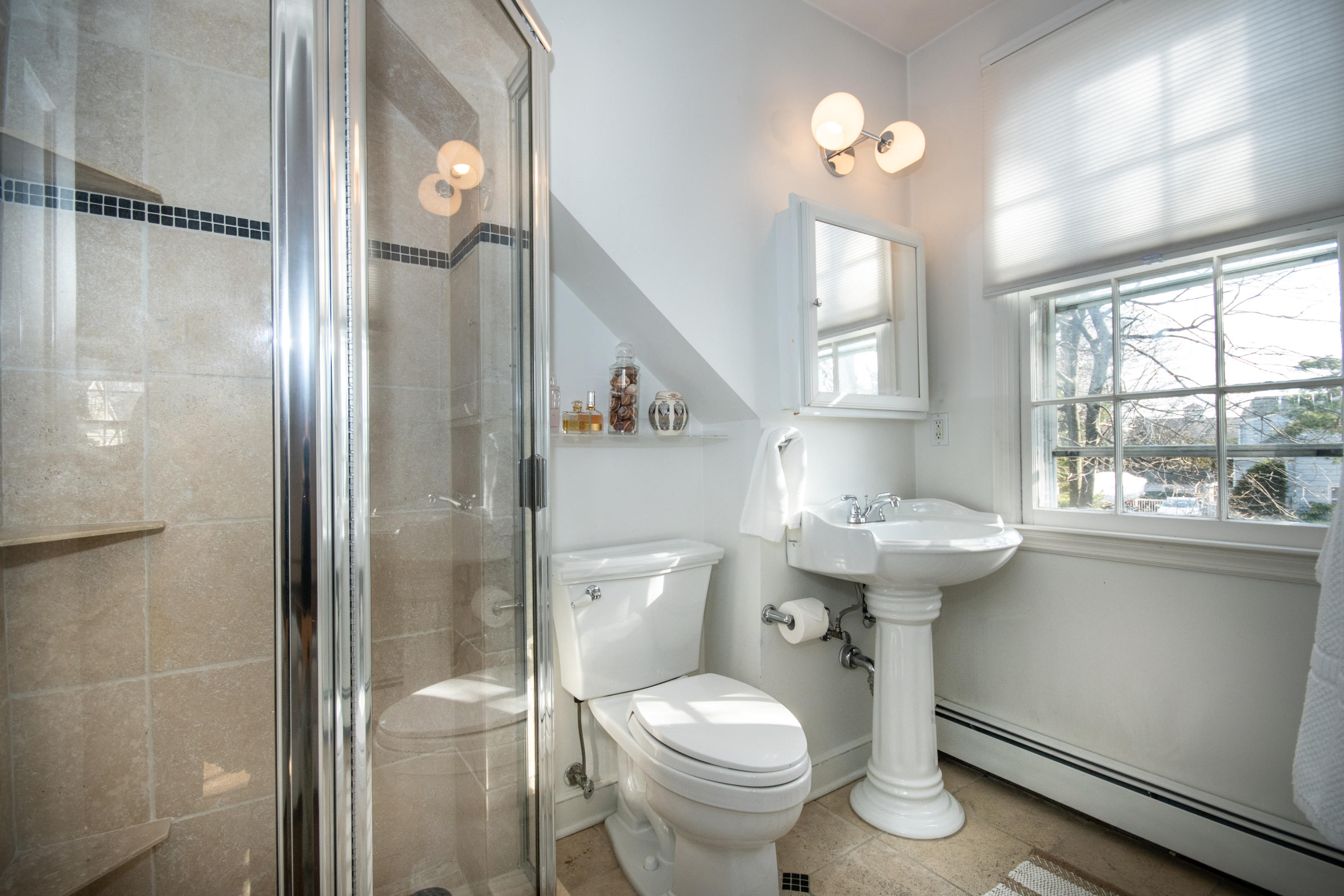 18 Seagate Road Darien, CT 06820 - Photo 15 of 27 a bathroom with a sink toilet and shower