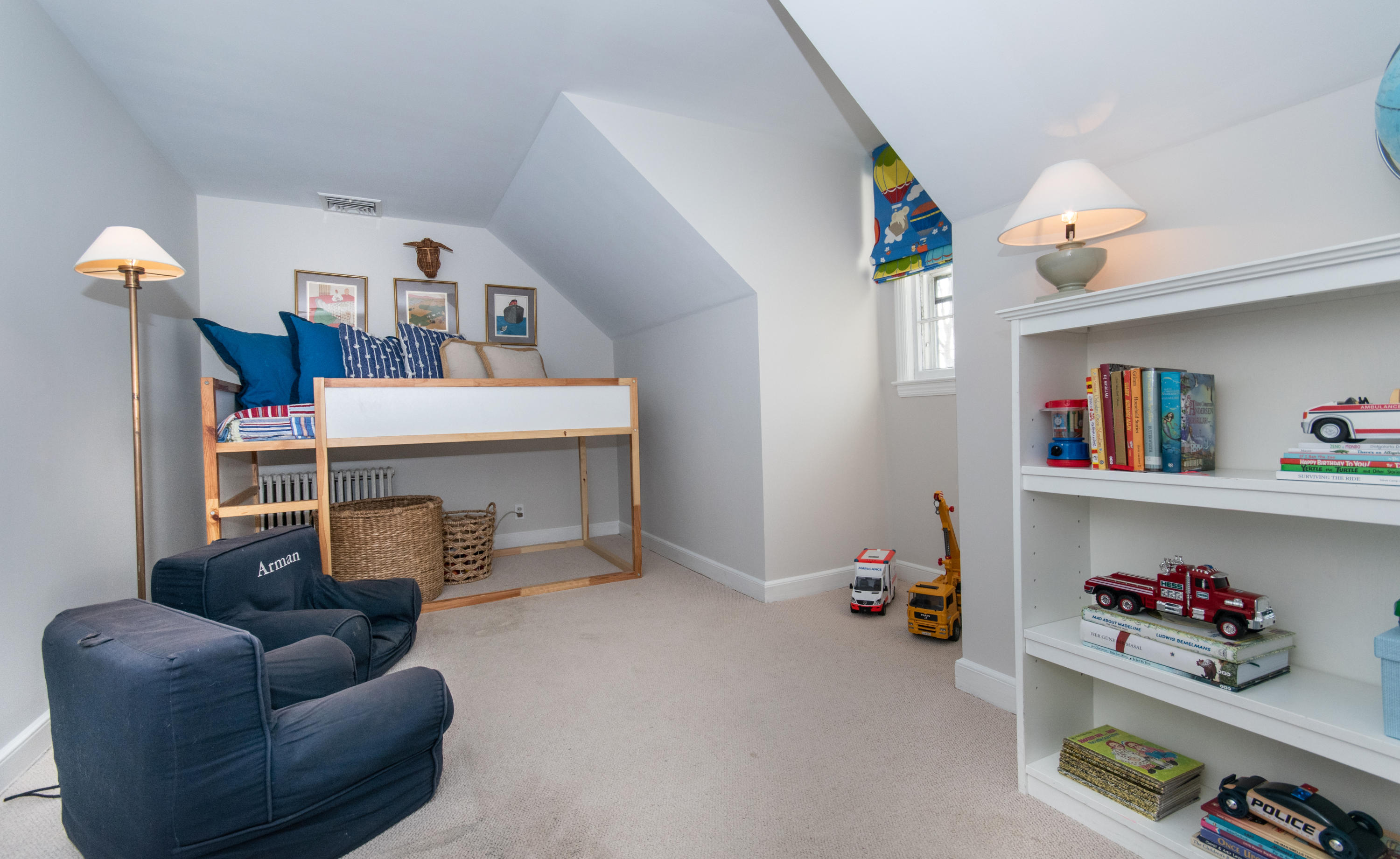 18 Seagate Road Darien, CT 06820 - Photo 18 of 27 a room with furniture and a book shelf