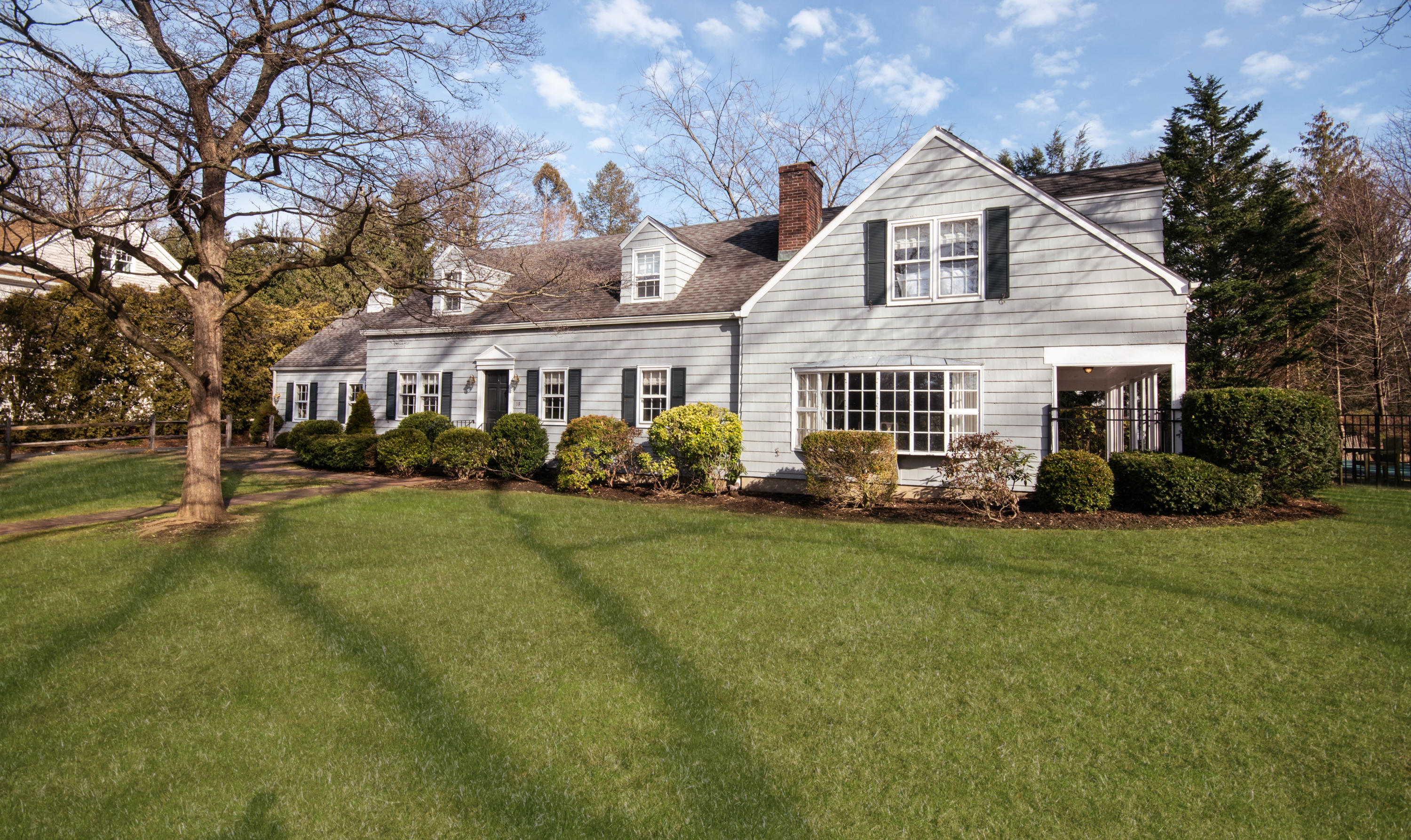 18 Seagate Road Darien, CT 06820 - Photo 2 of 27 a front view of a house with a garden