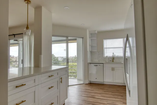 a view of a kitchen cabinets and wooden floor