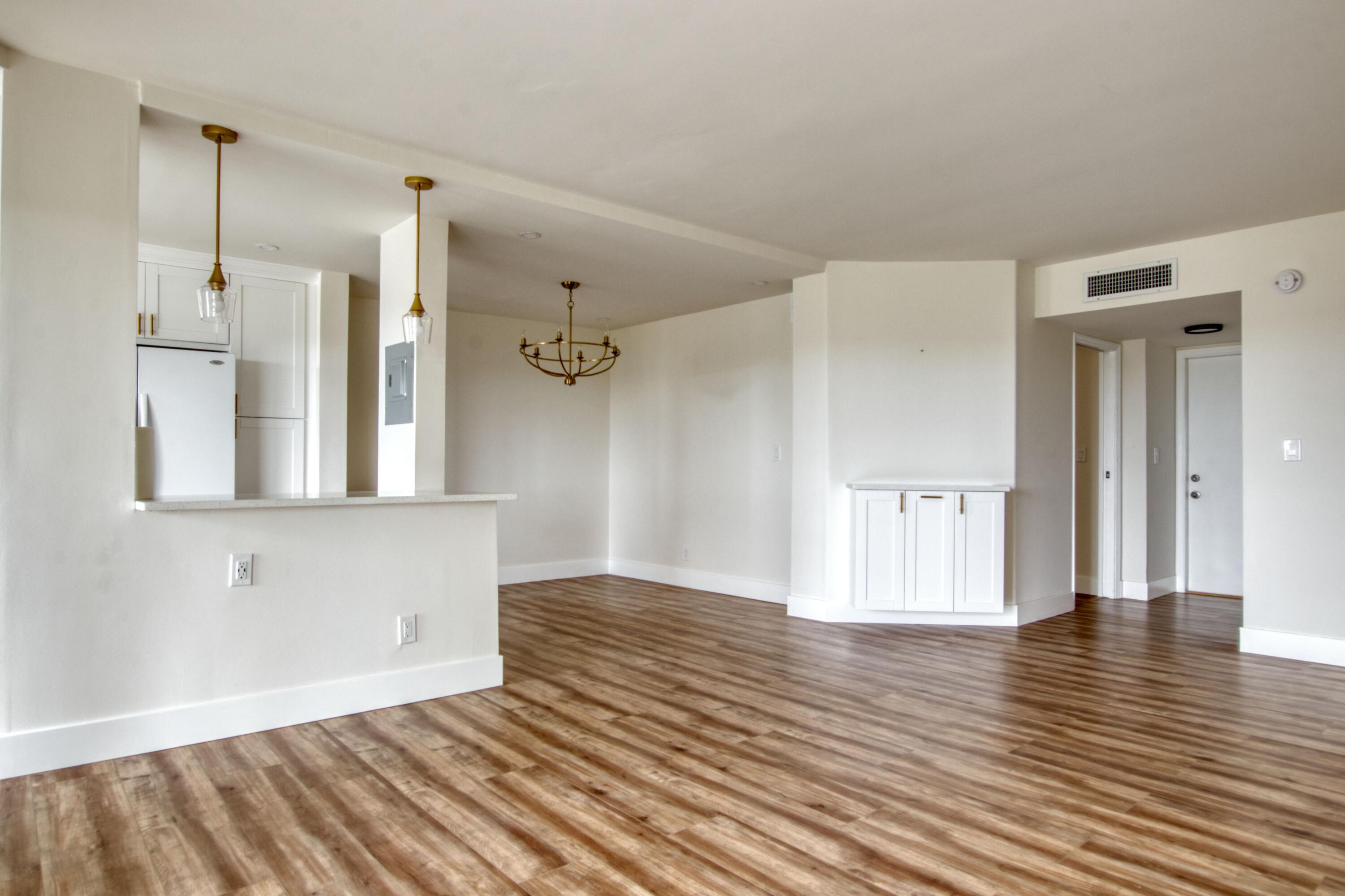 3590 Via Poinciana, Unit 614 Lake Worth, FL 33467 - Photo 8 of 20 a view of empty room with wooden floor and fan