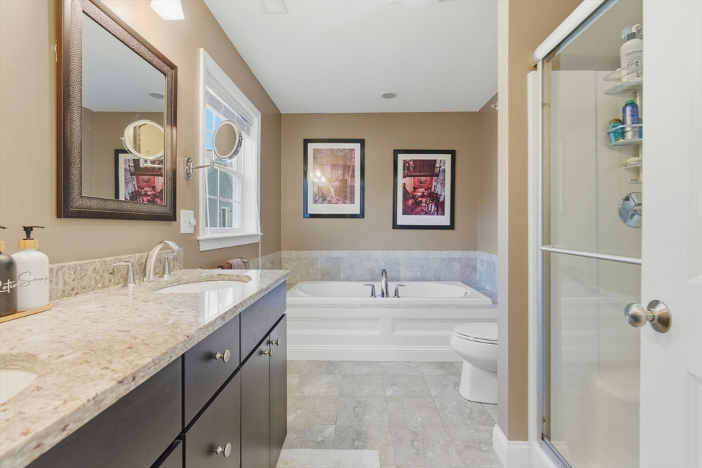 66 Compass Point, Unit 66 North Andover, MA 01845 - Photo 32 of 42 a bathroom with a granite countertop sink mirror vanity and toilet
