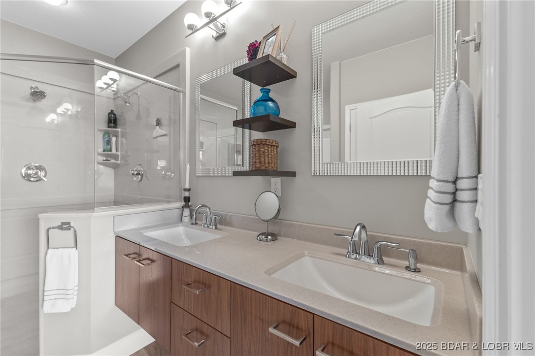100 Trinity Pointe Drive, Unit 2L Camdenton, MO 65020 - Photo 18 of 43 Master Bath with Dual Floating Vanities and Walk i