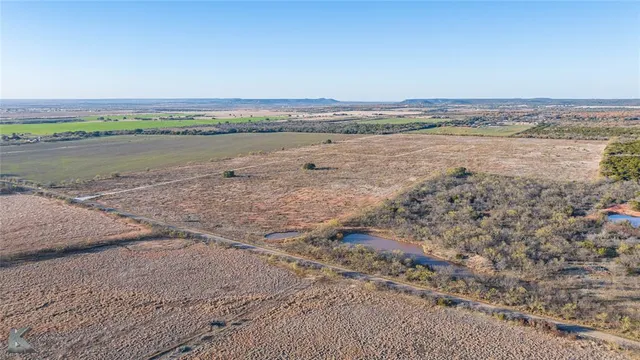 a view of an ocean beach and city
