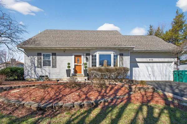 a front view of house with yard outdoor seating and barbeque oven