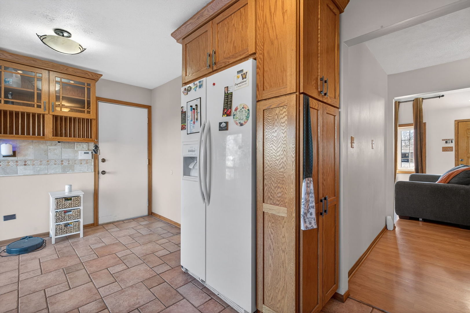 805 Addleman Street Joliet, IL 60431 - Photo 12 of 31 a view of a refrigerator in kitchen and a window