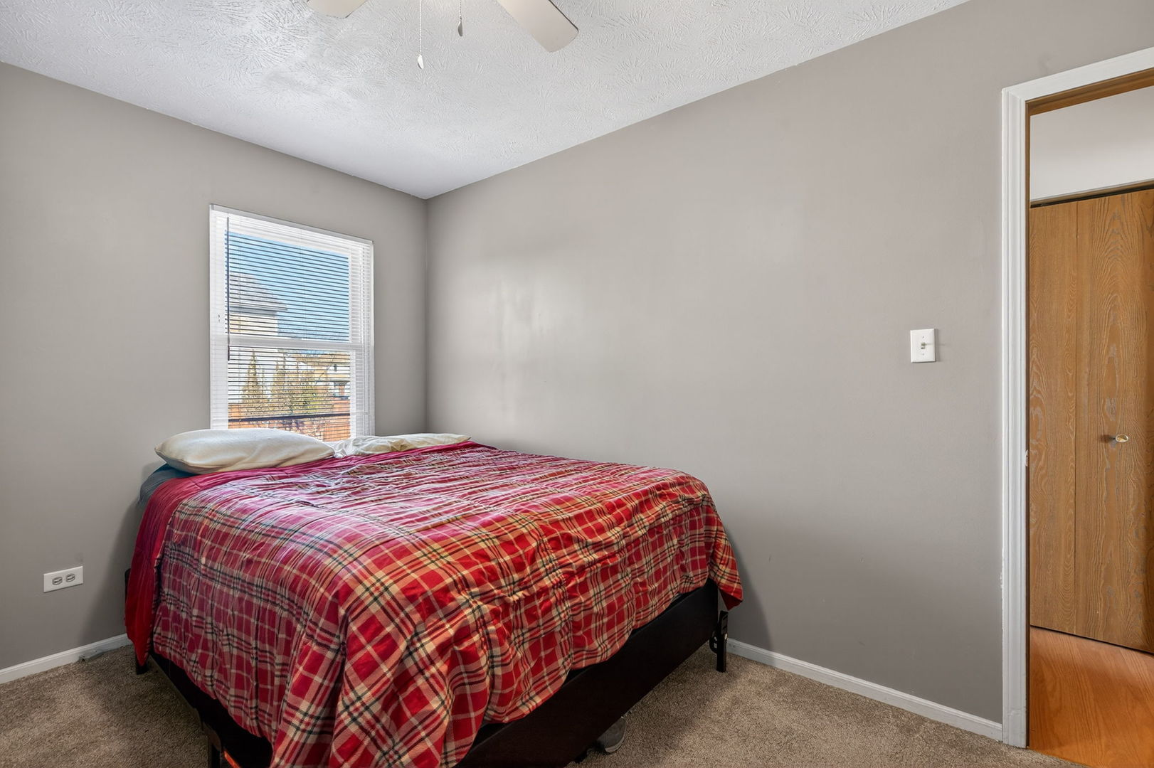 805 Addleman Street Joliet, IL 60431 - Photo 19 of 31 a bedroom with a bed and window