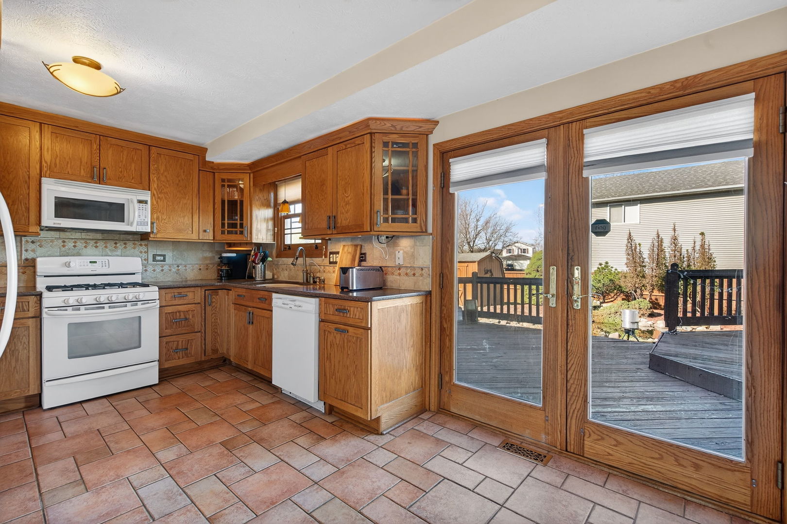 805 Addleman Street Joliet, IL 60431 - Photo 8 of 31 a kitchen with a stove a sink and a refrigerator