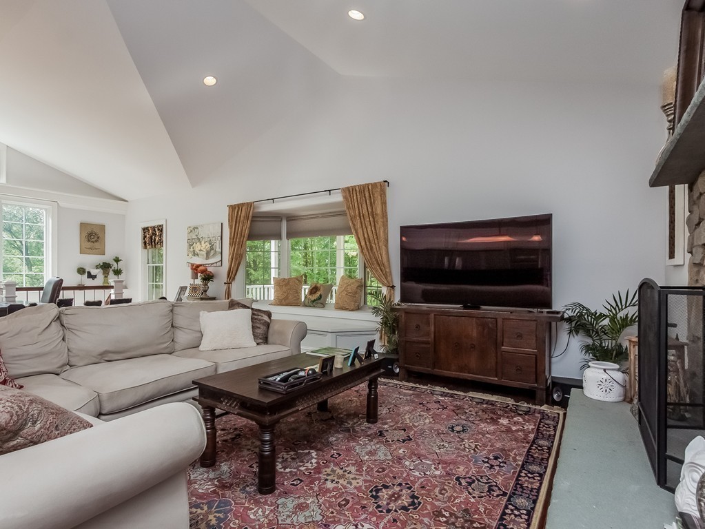 208 Southampton Road Holyoke, MA 01040 - Photo 12 of 30 a living room with furniture and a flat screen tv