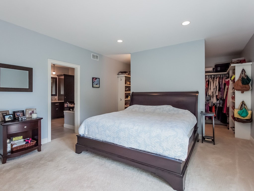 208 Southampton Road Holyoke, MA 01040 - Photo 15 of 30 a spacious bedroom with a bed and a lamp