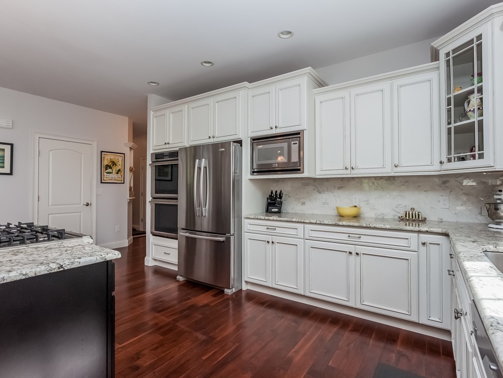 208 Southampton Road Holyoke, MA 01040 - Photo 5 of 30 a kitchen with a refrigerator stove and microwave