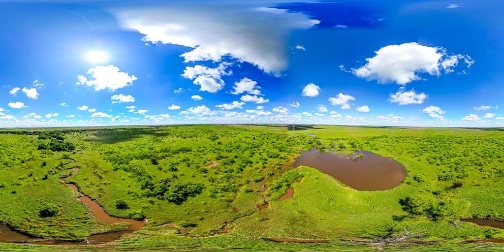 a view of a golf course with a yard